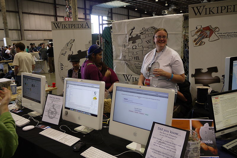 The Wikimedia Foundation Booth, at Maker Faire   <small>[© CC-BY-SA-3.0 Slaporte](http://commons.wikimedia.org/wiki/File:Wikimedia_booth.JPG)</small>” width=”600px”/><figcaption class=